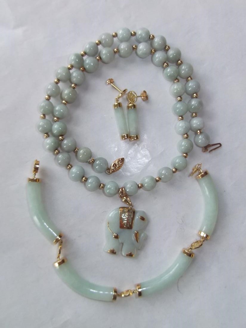 Gold mounted jade type hinged bracelet, bead necklace and a pair of earrings
