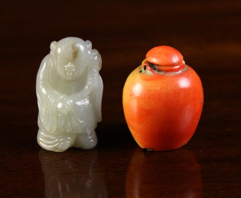 A 19th Century Carved Jade Figure of a Boy, 2 ins (5 cms) in height, and a 19th century ovoid