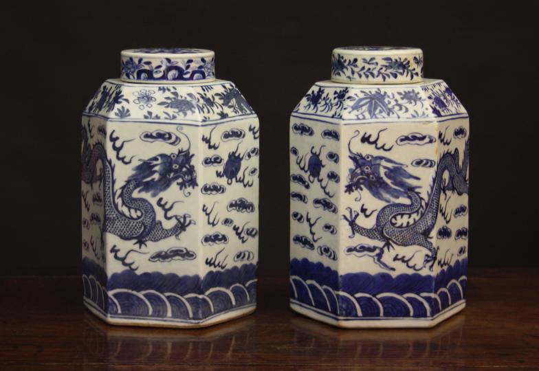 A Pair of 19th Century Blue & White Chinese Jars.  The hexagonal bodies with canted shoulders and