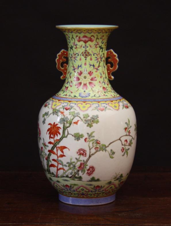 A Chinese Baluster Vase decorated in polychrome enamels with peach blossom and scrolling flowers &