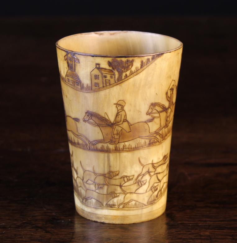 A Delightful Late 18th Century Horn Beaker engraved with a hunting scene spiraling around the sides,