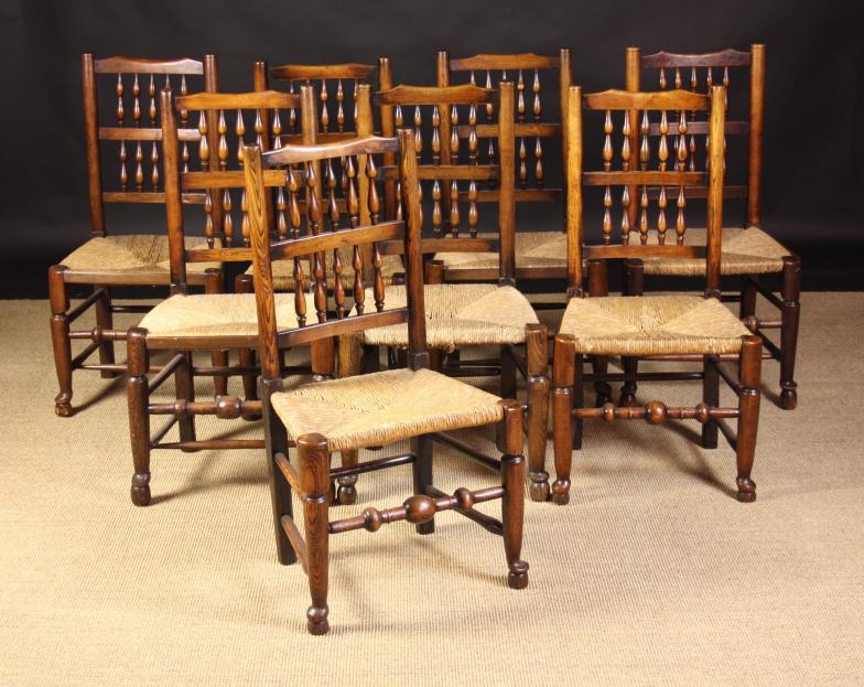 A Good Harlequin Set of Eight Spindle-backed Rush-seat Chairs attributed to Lancashire/Cheshire