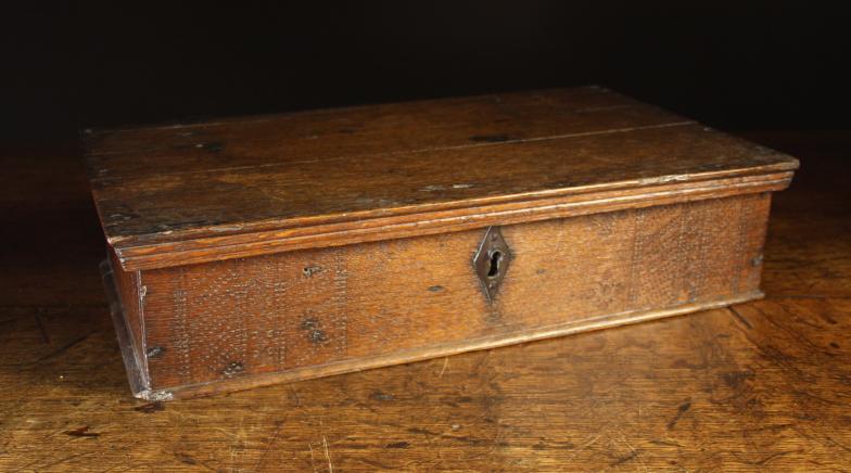 A Small 18th Century Oak Box embellished with punchwork and enclosing a small lidded till to the