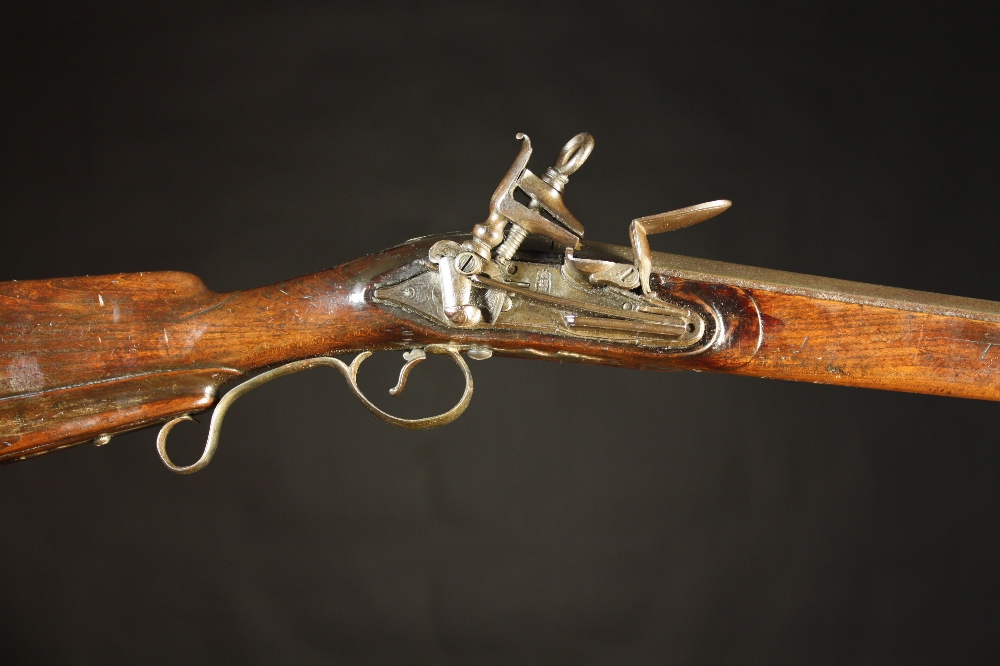 A Spanish Miquelet Flintlock Sporting Gun, Circa 1800. The barrel inlaid in gold with makers name