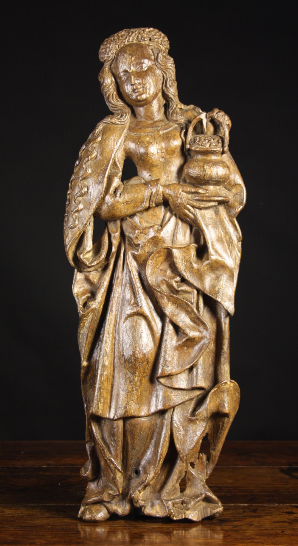 A 16th Century Oak Relief Carving of a Woman dressed in a flowing robe with long curly hair