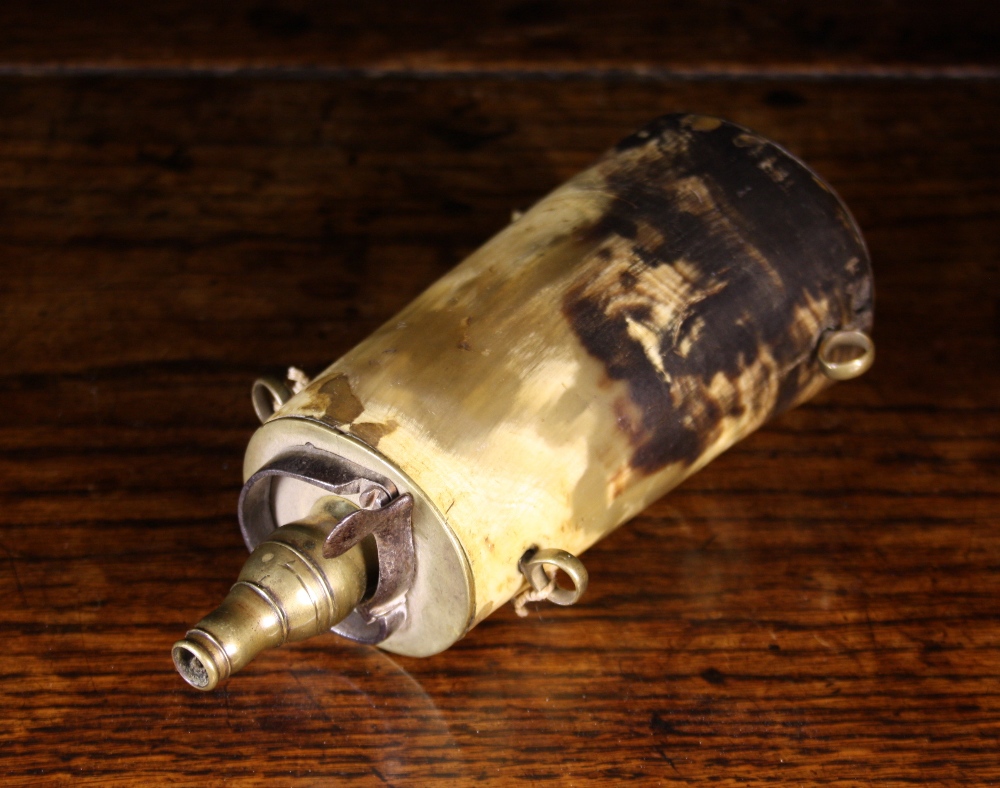 A 19th Century Brass Mounted Horn Powder Flask, 7 ins (18 cms) in length.