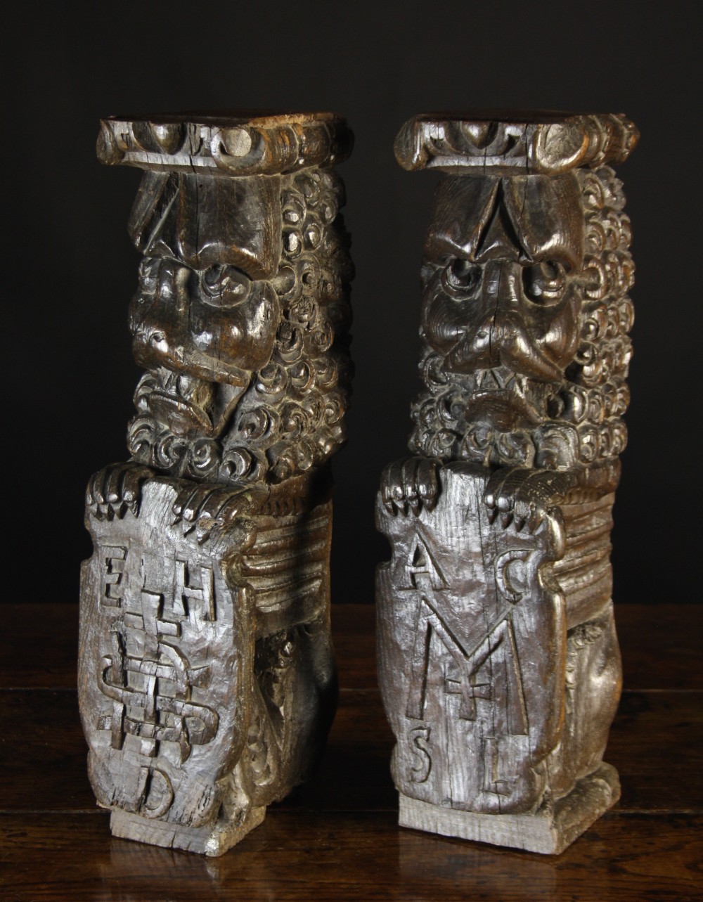 A Pair of Magnificent 16th Century Oak Posts boldly carved in the form of Heraldic Lions with lavish