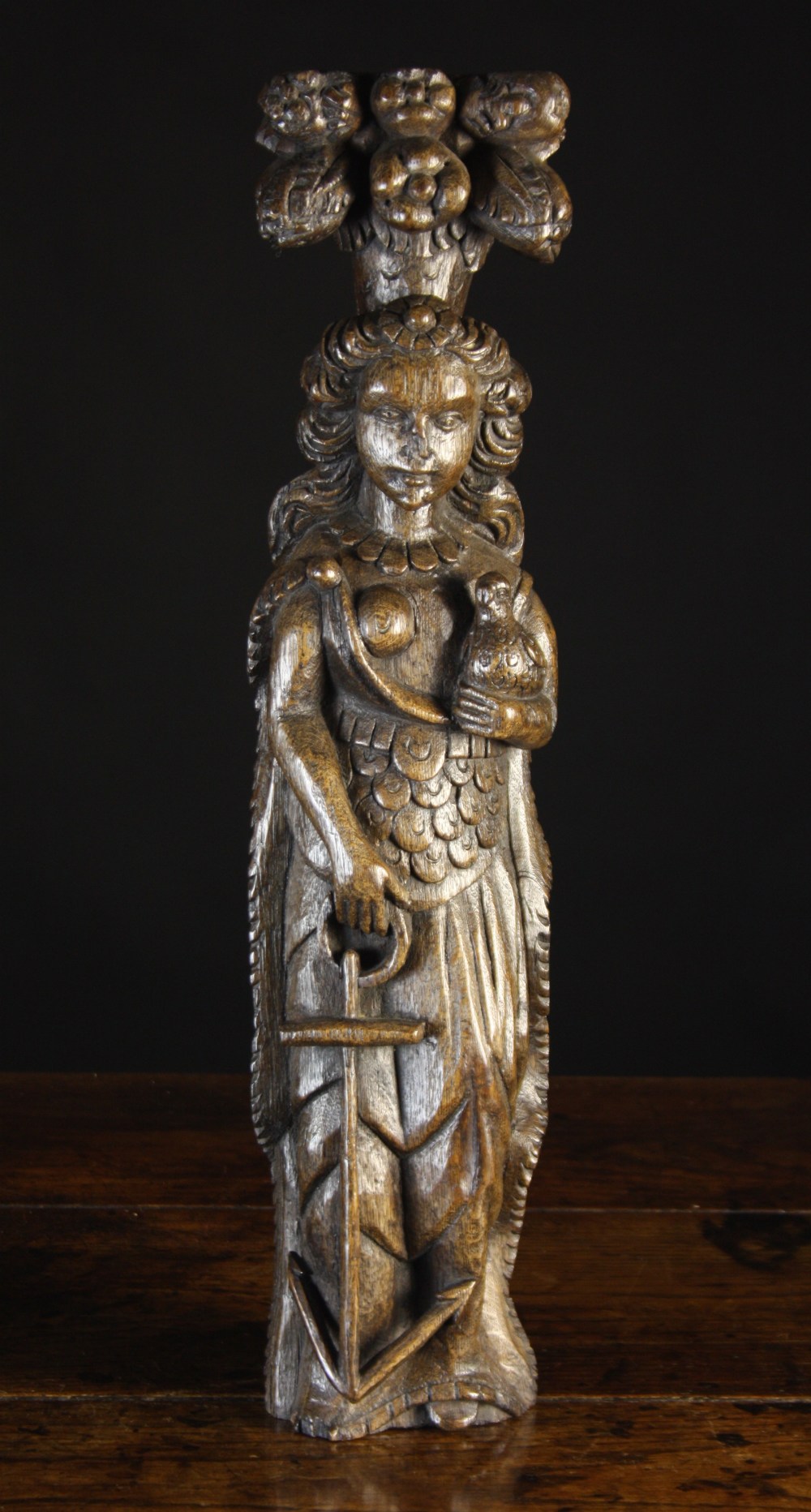 A Charming 17th Century Oak Pilaster carved in high relief with a symbolic female figure