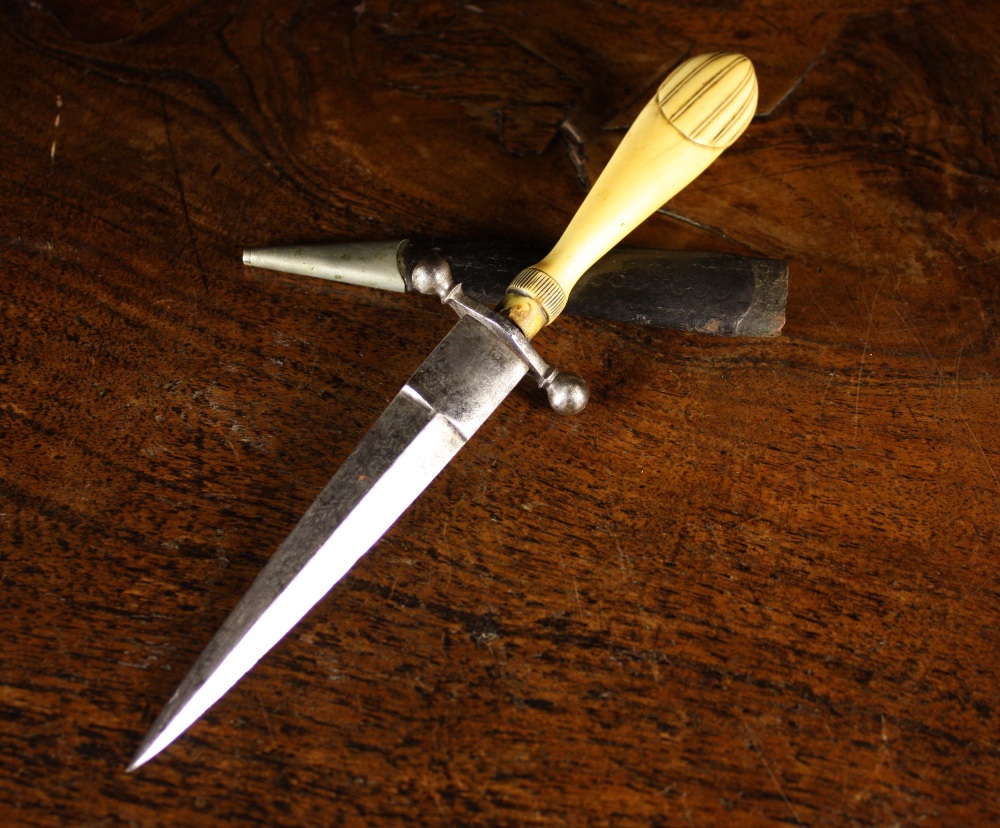 An 18th Century Dagger with bone handle.  The steel blade etched with flowers & foliage, and