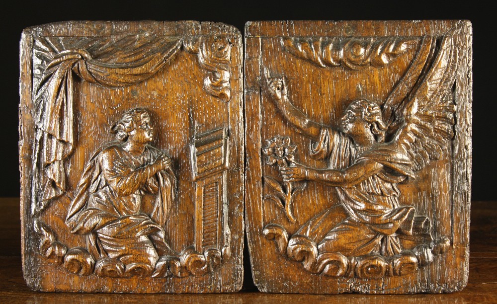 A Pair of 17th Century Relief Carved Oak Panels depicting 'The Annunciation': Mary knelt praying