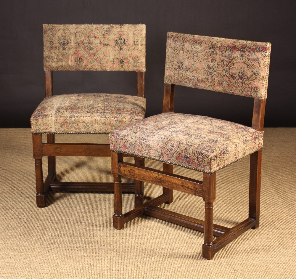 A Pair of 18th Century Walnut Side Chairs.  The low rectangular upholstered backs and seats