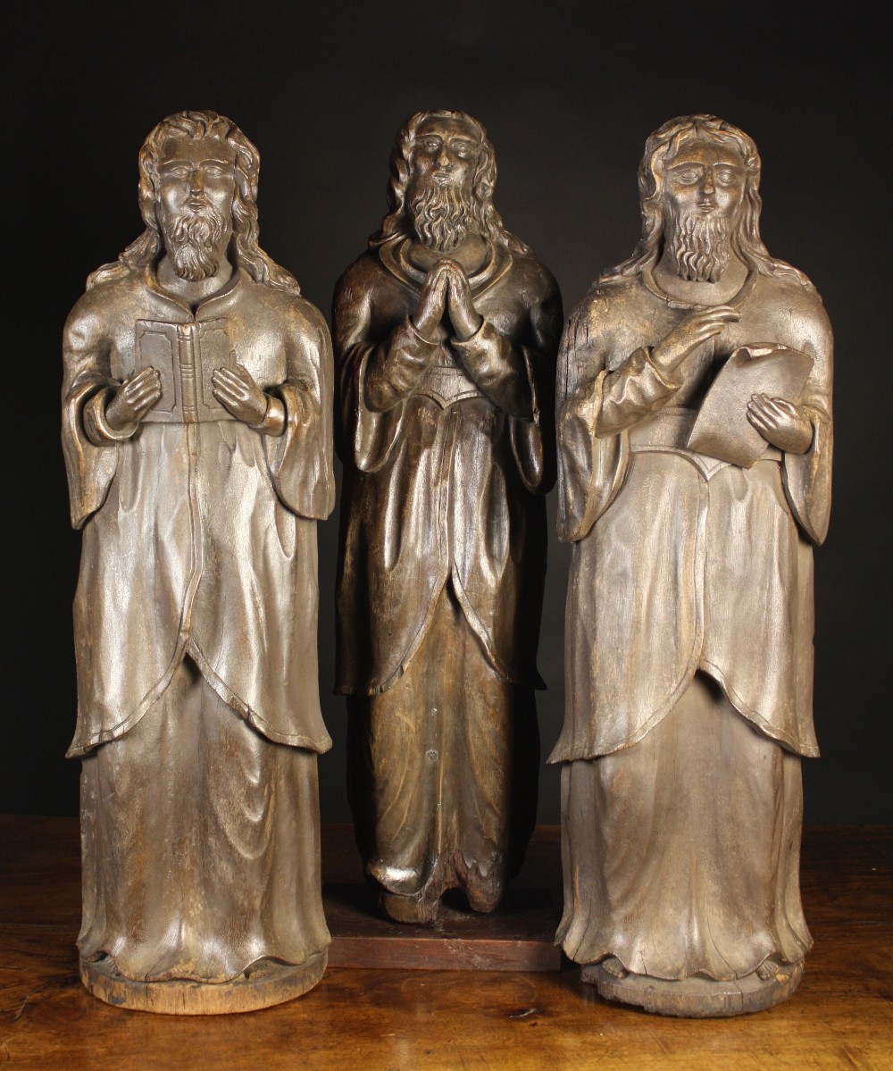 Three Late Medieval Carved Walnut Saints, Circa 1480-1520, 35 ins (89 cms) in height.