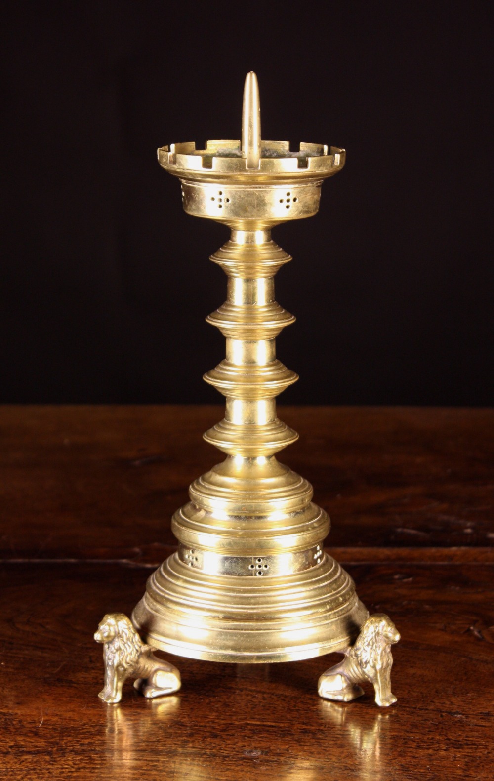 A 19th Century Gothic Revival Pricket Stick, having a multi blade knopped stem, crenellated drip pan