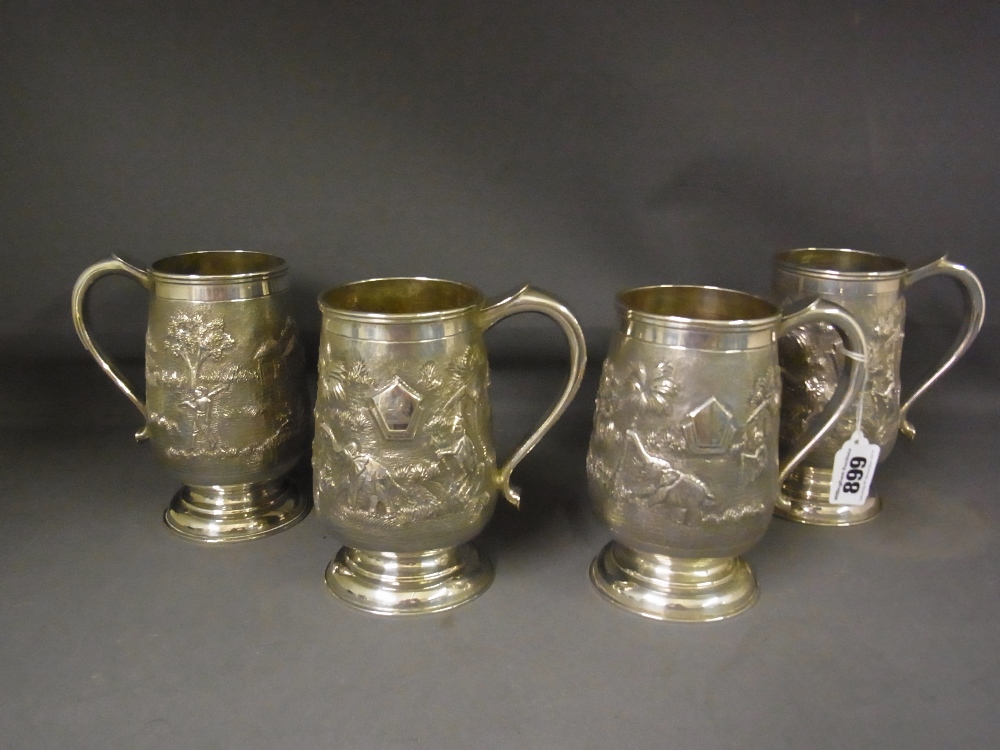 A set of four Indian Sterling silver embossed Beer tankards - Weight approx. 42 troy oz -
Height
