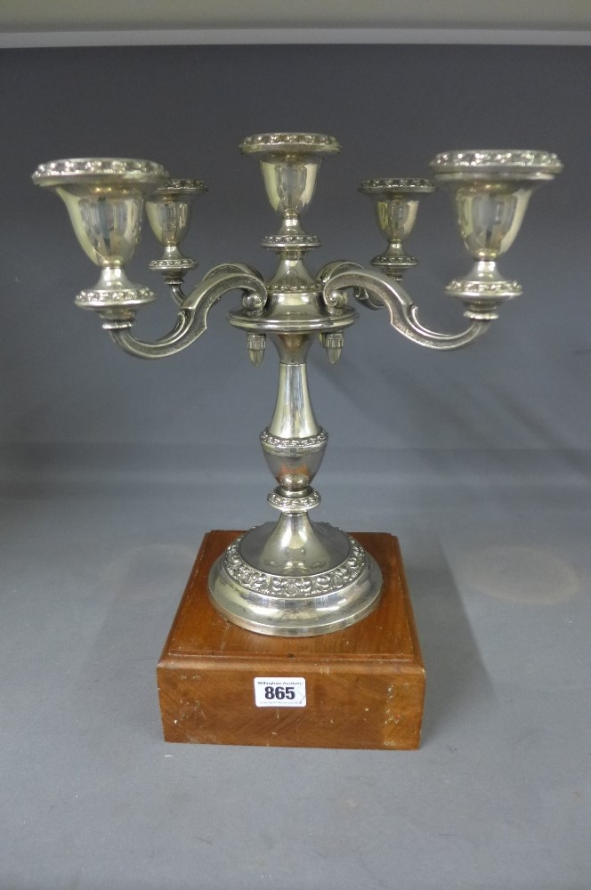 A silver plated five light candelabra on a mahogany trophy base - Height 36 cm 
Condition report: