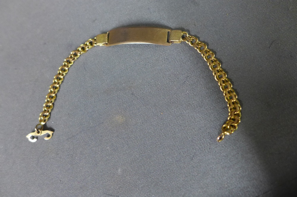 A gold identity bracelet 18cm long tests to approx 14ct gold approximate weight 11 grams
