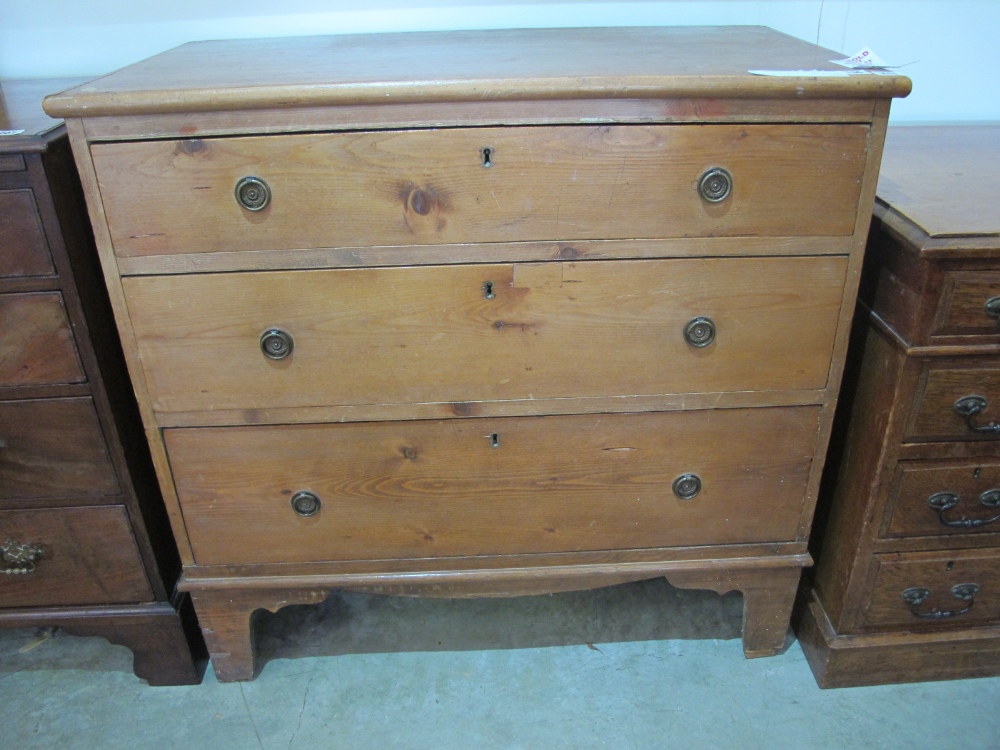 A late 19th century pine chest of three graduated drawers on bracket feet - Width 89cm