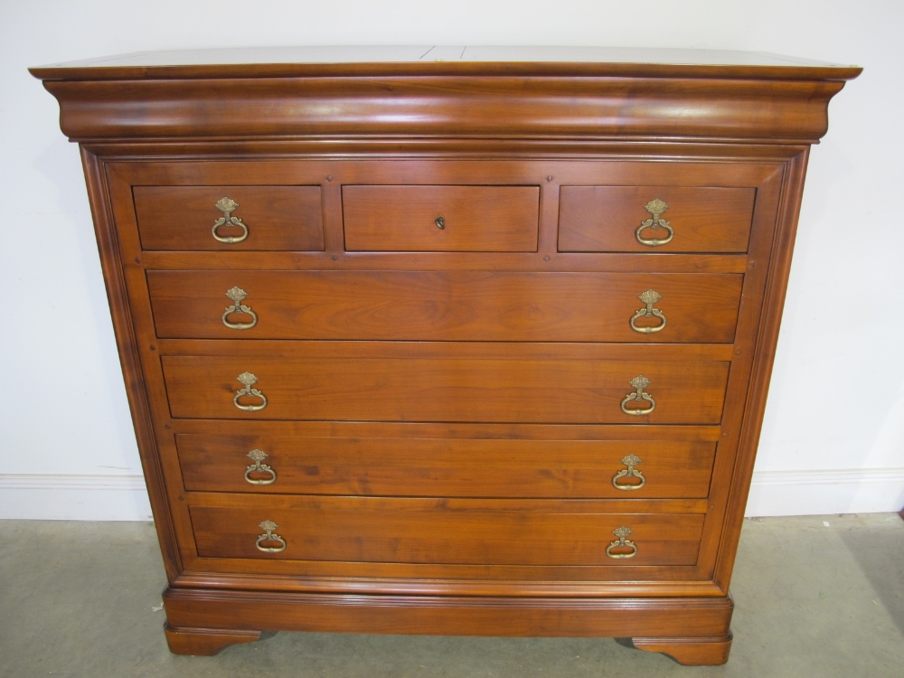 A modern Brigitte Forester walnut chest of three short and four long drawer - Width 135 cm