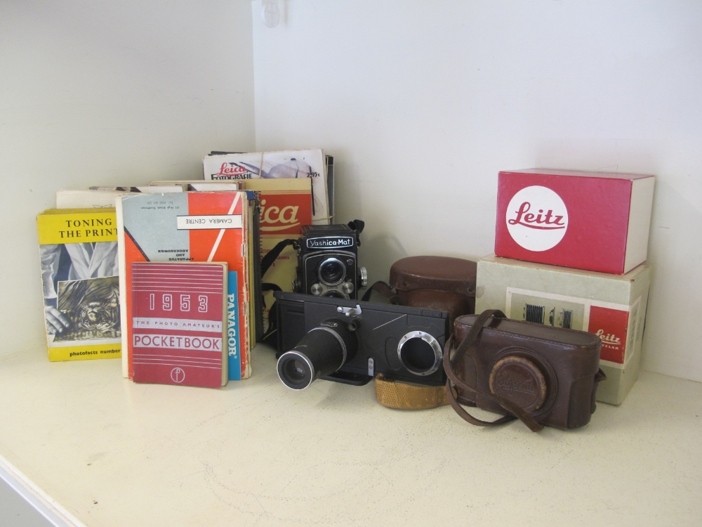 A Zorki camera no. 159417 with 1.35 f = 80 mm lens, a Yashica J no. J2011563 and a quantity of Leitz