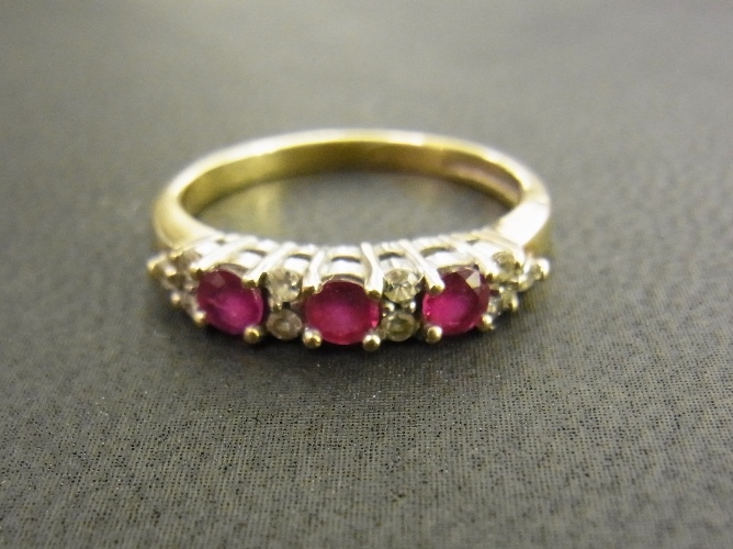 A 9ct gold ruby and diamond ring - Hallmarked Birmingham - Ring size L - Weight approx 2.2gms