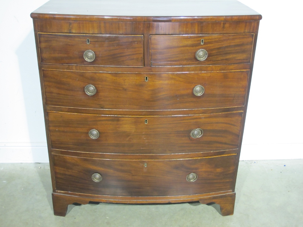A 19th century mahogany bowfronted chest of drawers with two over three long drawers - Height 1.06 m