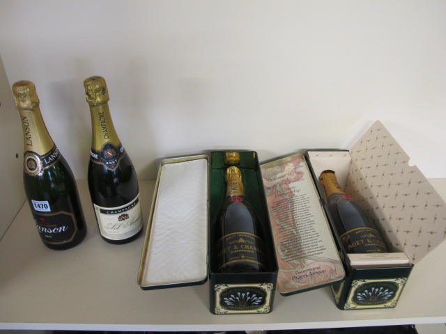 Two bottles of Moet and Chandon Champagne 1986 and 1988 both in their original presentation tins