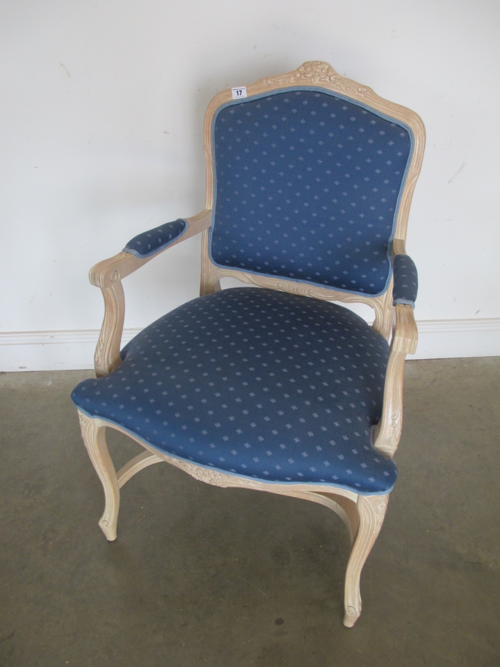 A modern blue upholstered Louis XVI style open armchair