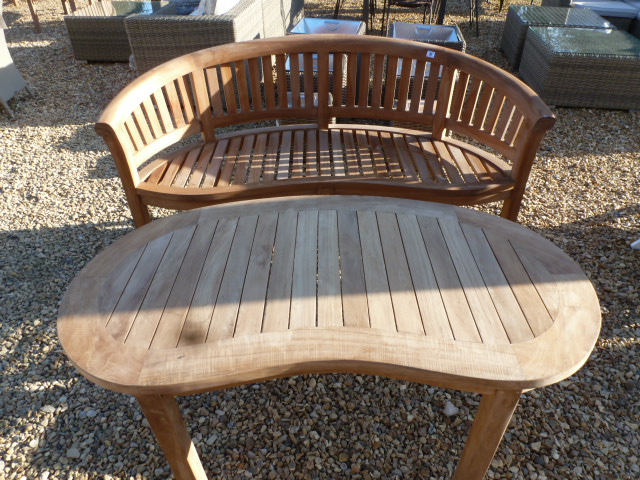 A Bramblecrest teak Banana bench with a matching coffee table