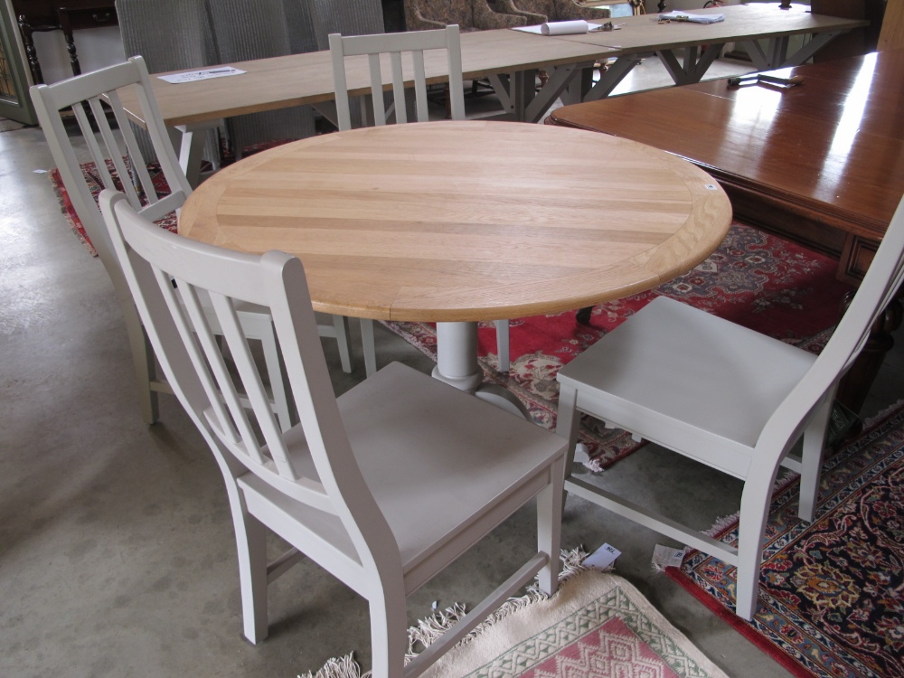 A Bramblecrest ex display pedestal table and four grey chairs - Diameter 120cm