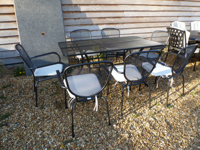 A Bramblecrest mesh rectangular table and six armchairs - with cushions