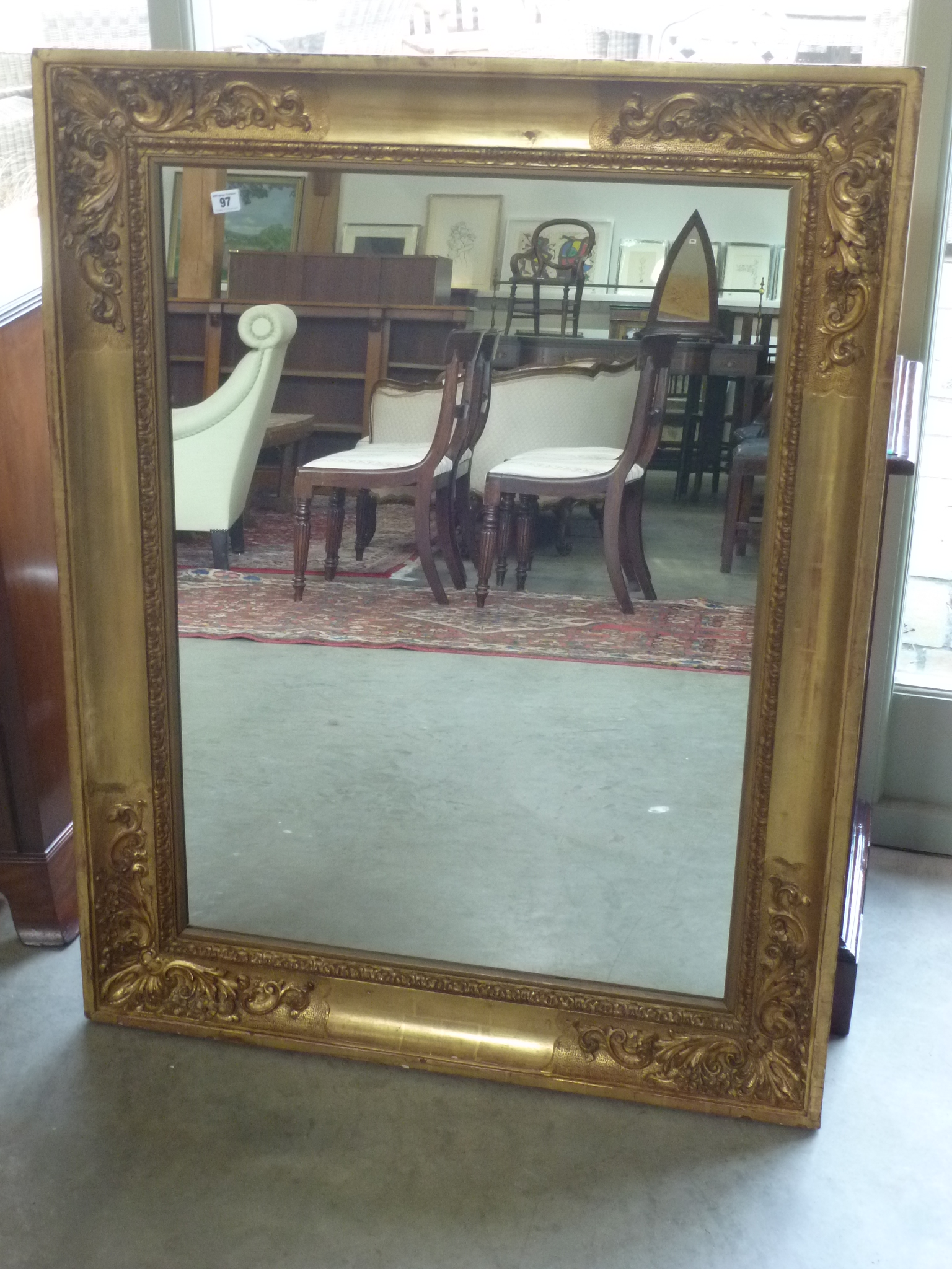 A gilt framed mirror - 90 cm x 15 cm