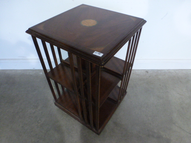 A modern mahogany revolving bookcase