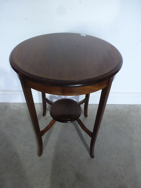 An Edwardian mahogany and inlaid circular side table