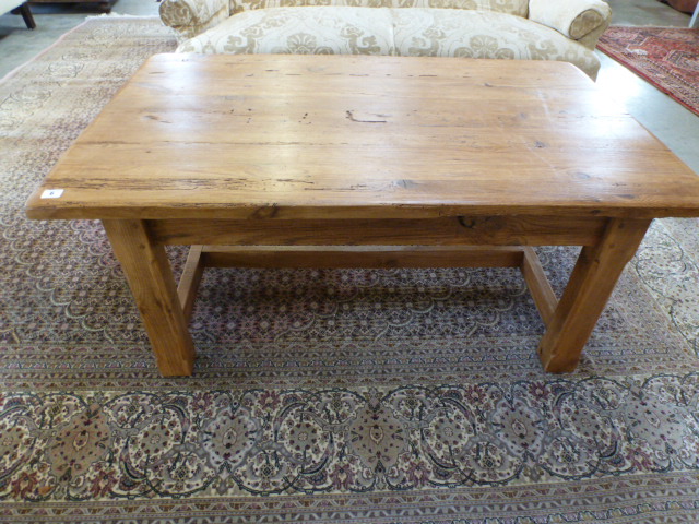 A stripped and waxed pine coffee table