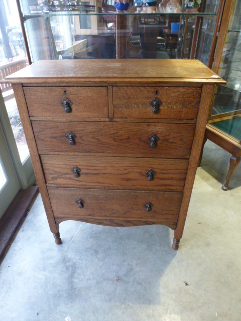 An oak chest with two short over three long drawers - Height 110cm x Width 90cm