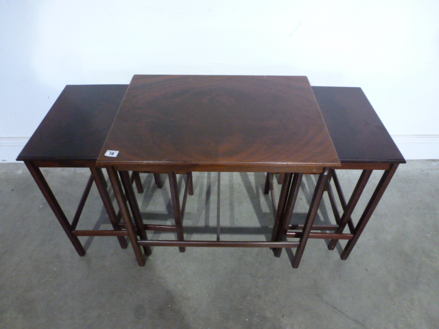 A nest of five mahogany side tables