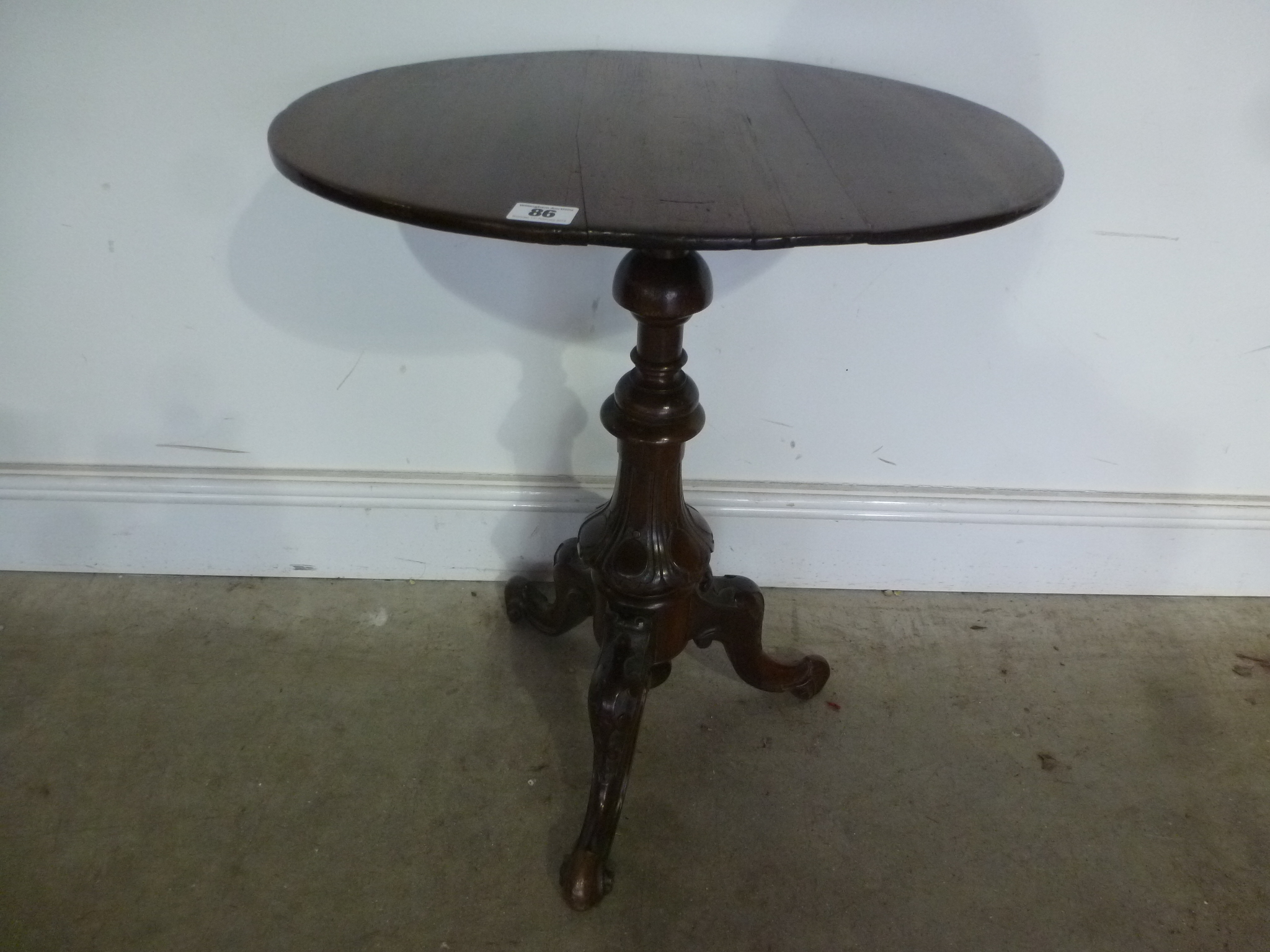 A 19th century mahogany wine table on a carved tripod base - Height 60 cm x 50 cm x 41 cm