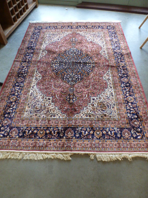 A rose ground Keshan carpet - 2.30 m x 1.60 m