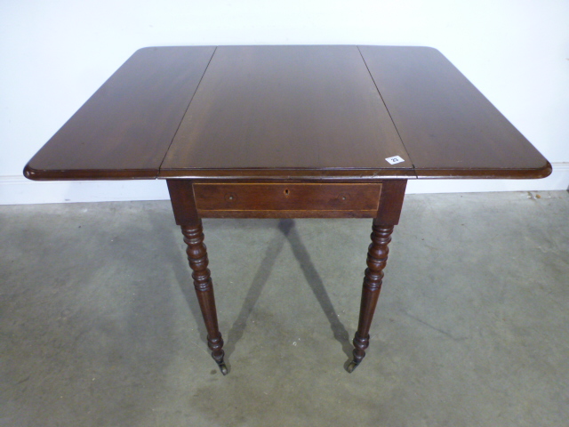 A 19th century mahogany Pembroke table on turned legs