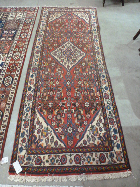 A good Shiraz runner with scrolling flower heads on a red field - 297 cm x 106 cm