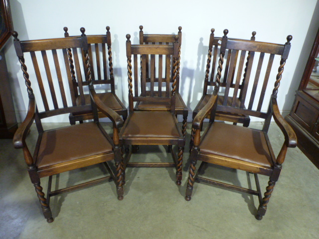 A 1930's oak gateleg table on barleytwist legs