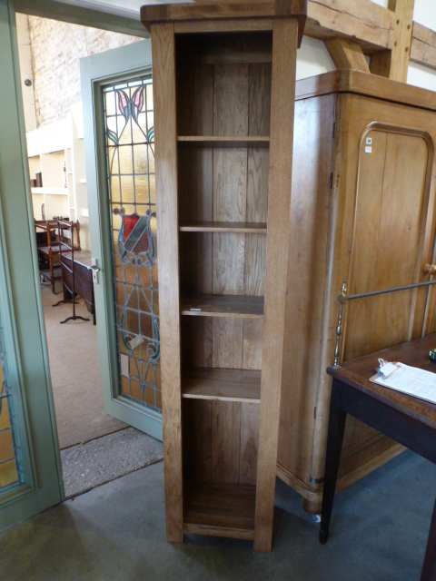 An oak ex display slim bookcase - Height 202 cm x Width 50 cm x Depth 32 cm