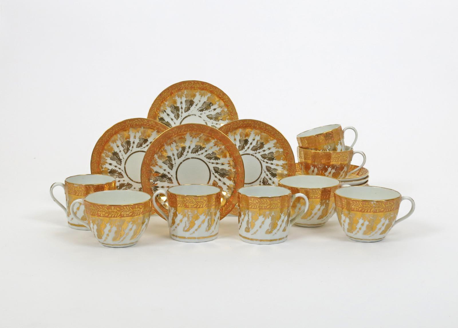 An English porcelain part tea service  early 19th century, the fluted forms decorated with formal