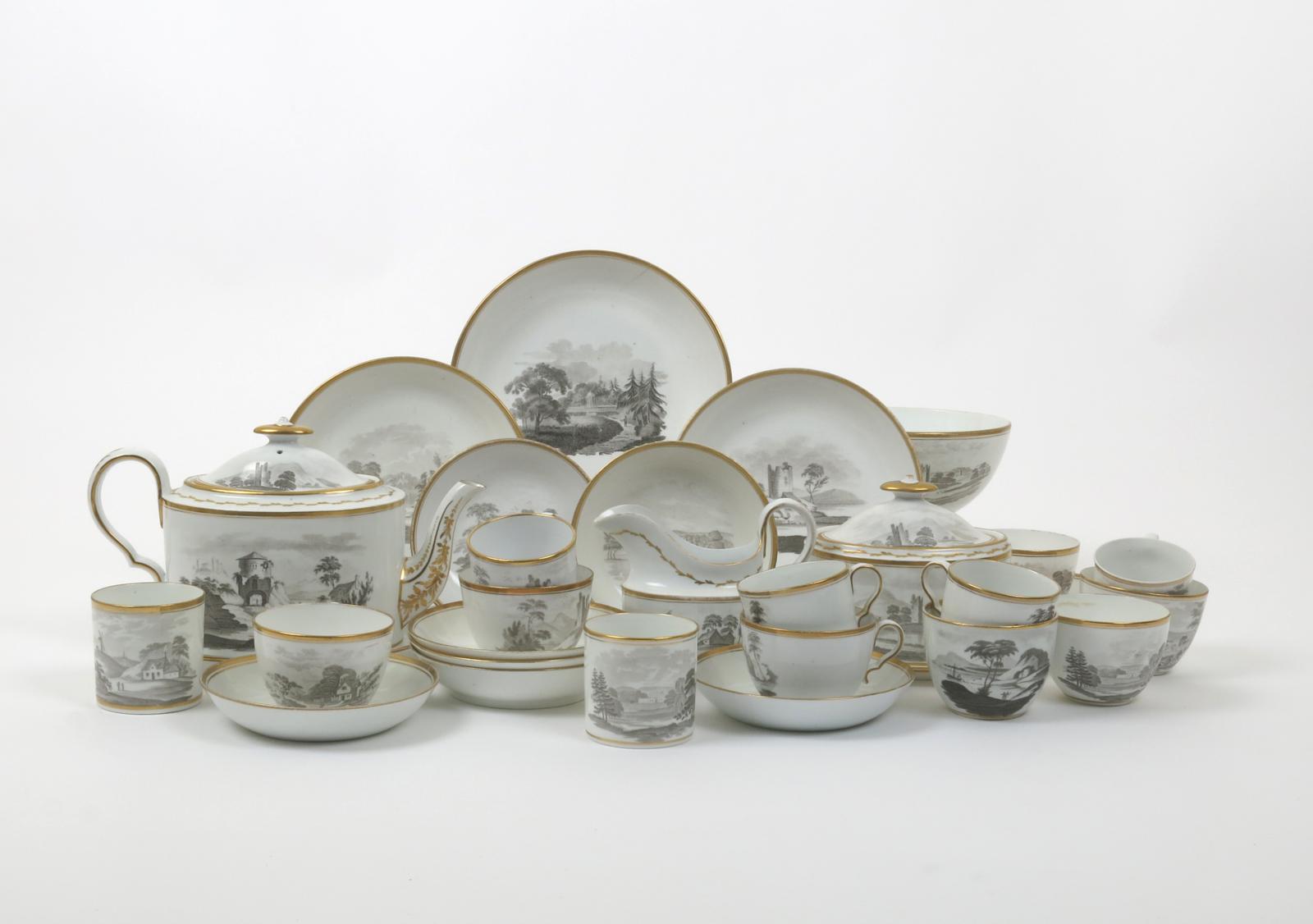 A Spode tea service  c.1810, bat-printed in pattern 557 with small figures before ruins or thatched