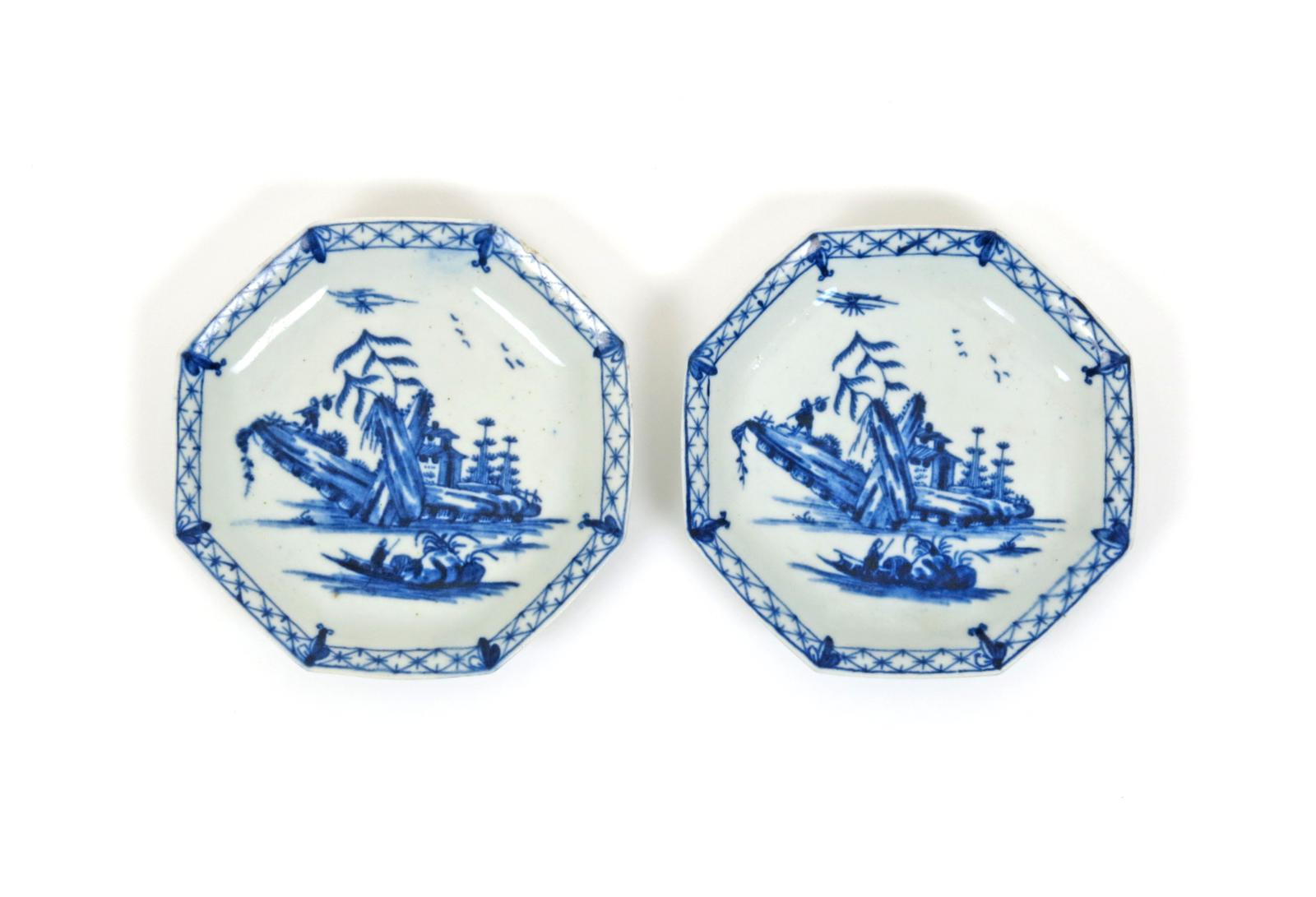 A rare pair of Worcester octagonal blue and white saucers  c.1755, painted with the Romantic Rocks