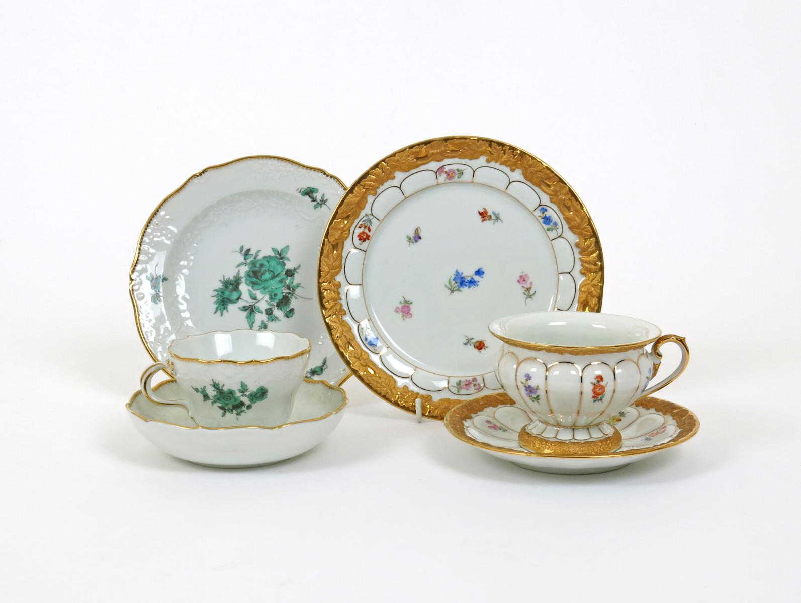 Two Meissen cups and saucers with matching plates  20th century, one moulded with arched panels and