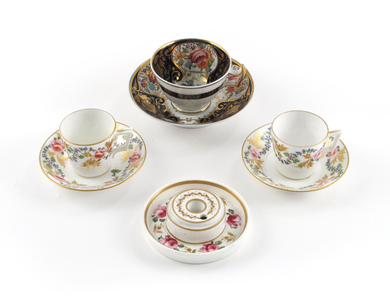 A good New Hall trio  early 19th century, and a further tea cup, painted with panels of flowers