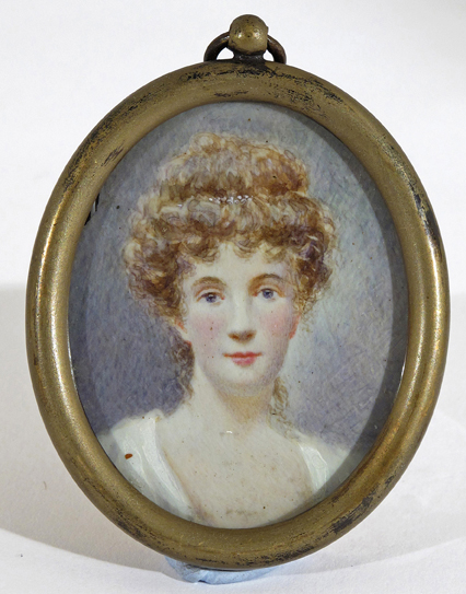 ? English School 19th Century A lady wearing white with pearls in her hair Oval in a brass frame