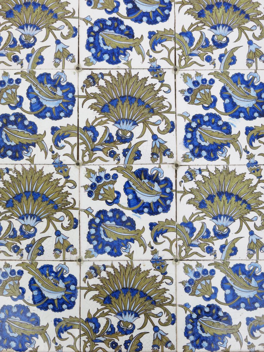 A Morris & Co Elsley twelve tile panel, tin-glazed tiles in shades of blue and green on a cream