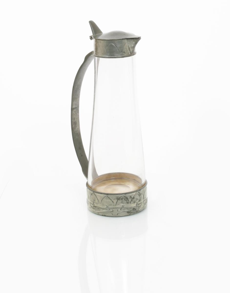 A Liberty & Co Tudric Pewter and glass ewer designed by Archibald Knox, model no. 0456, tapering